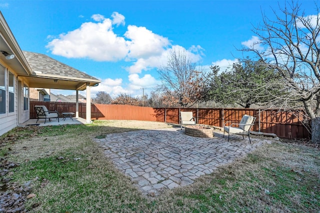 view of yard featuring a patio area and an outdoor fire pit