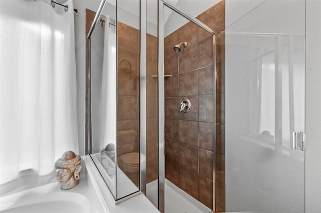 bathroom featuring a shower with door