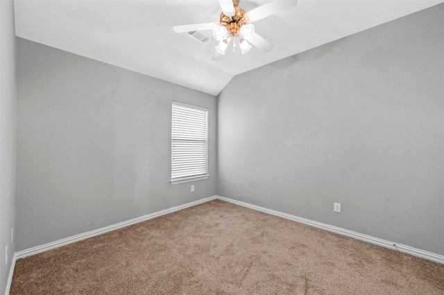 carpeted spare room with lofted ceiling and ceiling fan