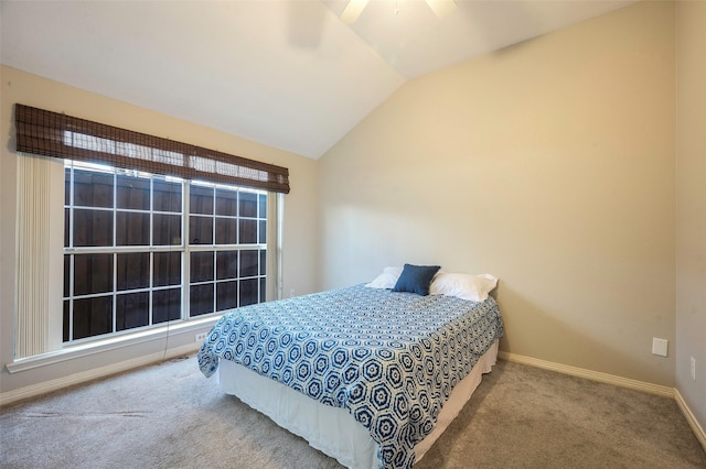 carpeted bedroom featuring ceiling fan and lofted ceiling