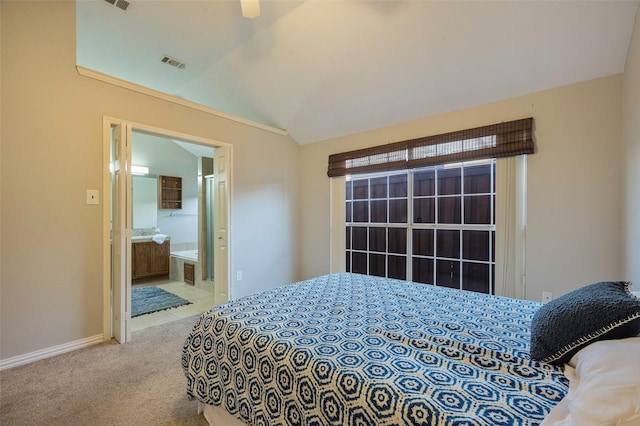 bedroom with ensuite bathroom, light carpet, ceiling fan, and lofted ceiling