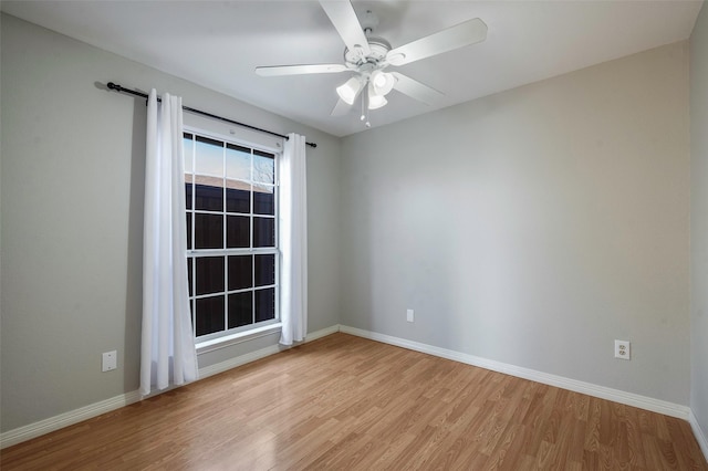 spare room featuring ceiling fan and light hardwood / wood-style floors