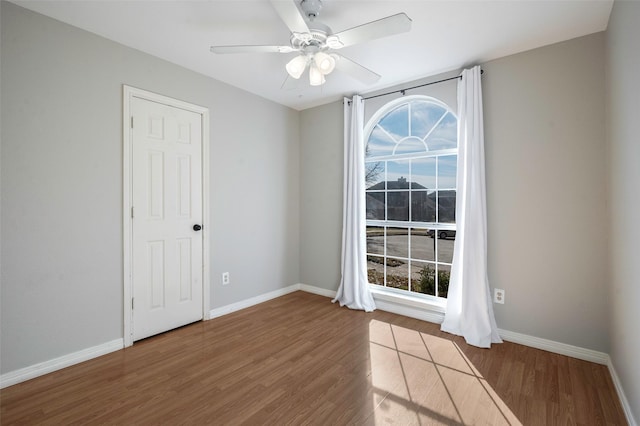 unfurnished room featuring ceiling fan and wood-type flooring