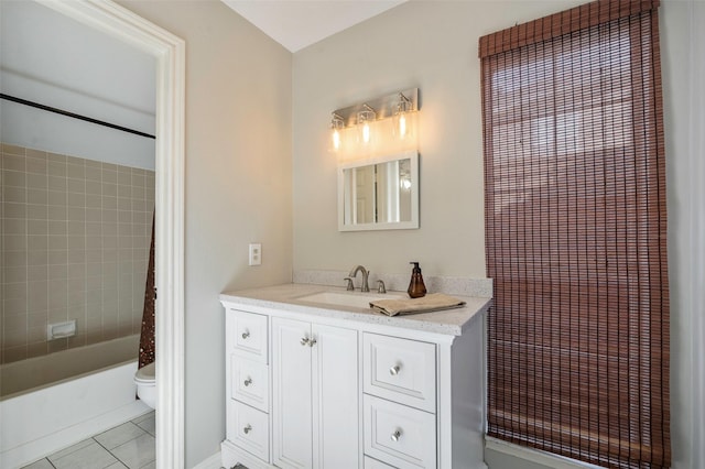 full bathroom featuring toilet, vanity, tile patterned flooring, and shower / bath combo