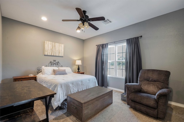 bedroom featuring ceiling fan and carpet