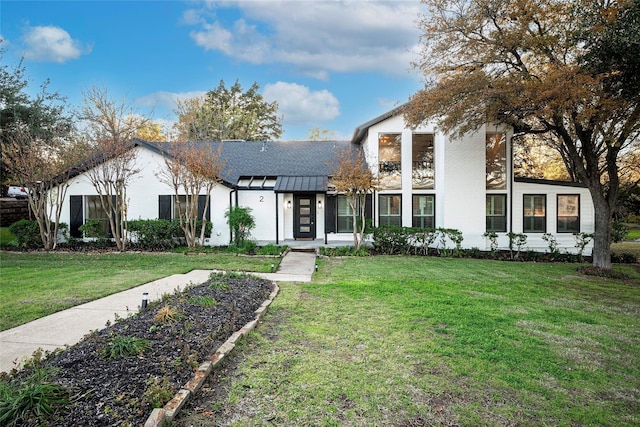 view of front of home with a front yard