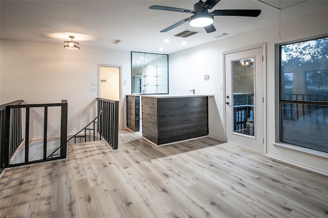 interior space featuring ceiling fan and light hardwood / wood-style flooring