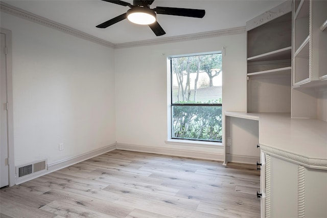 unfurnished room featuring ornamental molding, ceiling fan, and light wood-type flooring