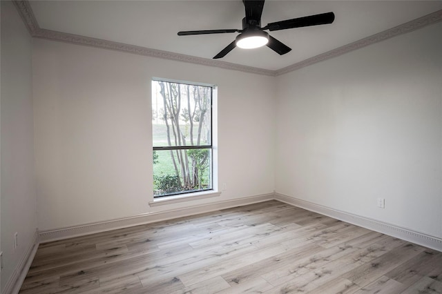 spare room with crown molding, light hardwood / wood-style floors, and ceiling fan