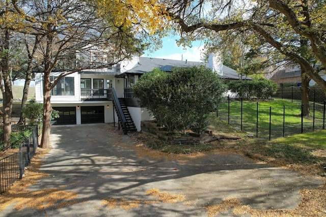 view of front of home with a garage and a front yard