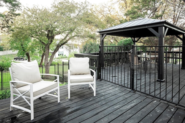 wooden terrace featuring a gazebo