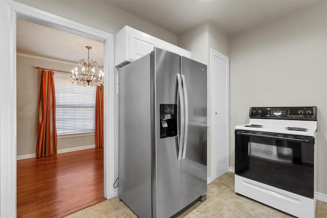 kitchen with light tile patterned flooring, range with electric cooktop, white cabinets, stainless steel fridge, and a chandelier