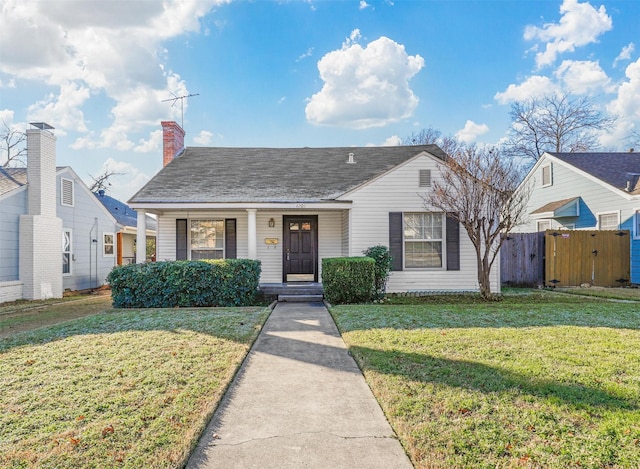 view of front of house featuring a front lawn and covered porch