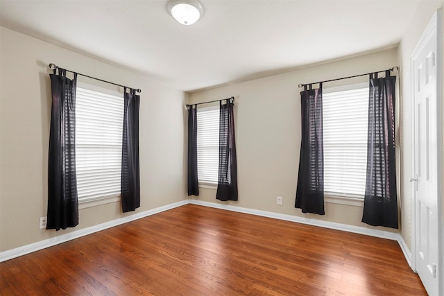 unfurnished room featuring hardwood / wood-style floors