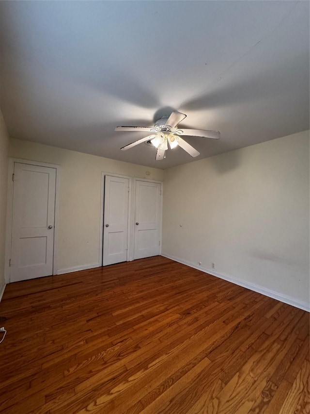 unfurnished bedroom featuring ceiling fan and hardwood / wood-style floors