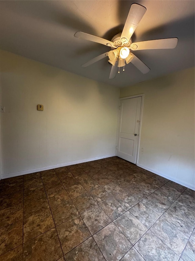 spare room with ceiling fan