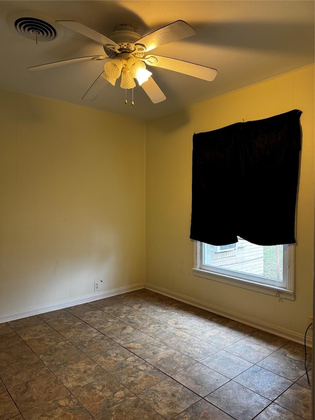 empty room featuring ceiling fan