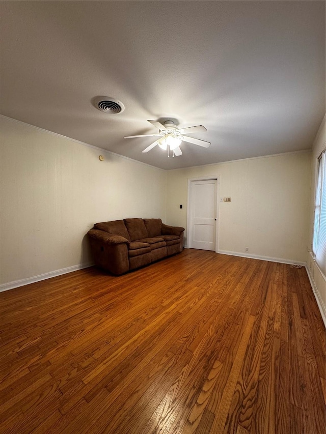 unfurnished living room featuring ceiling fan and hardwood / wood-style floors