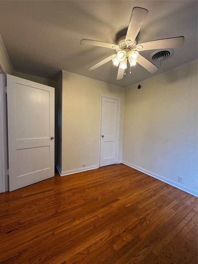 unfurnished bedroom with ceiling fan and hardwood / wood-style flooring