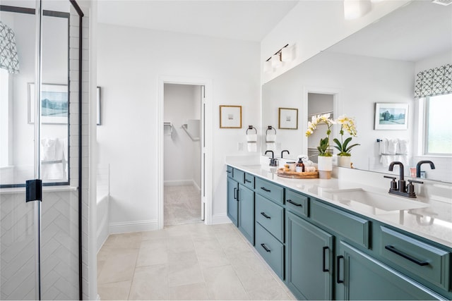 bathroom with vanity, tile patterned flooring, and a shower with door