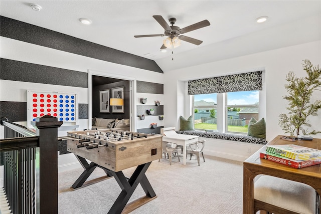 playroom featuring ceiling fan, light colored carpet, and vaulted ceiling