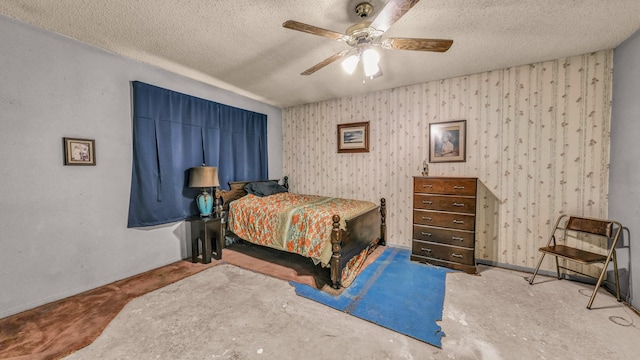 bedroom with ceiling fan and a textured ceiling