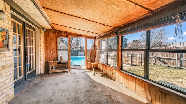 unfurnished sunroom featuring wooden ceiling and lofted ceiling