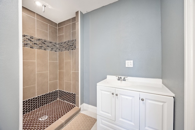 bathroom with vanity, tile patterned floors, and tiled shower