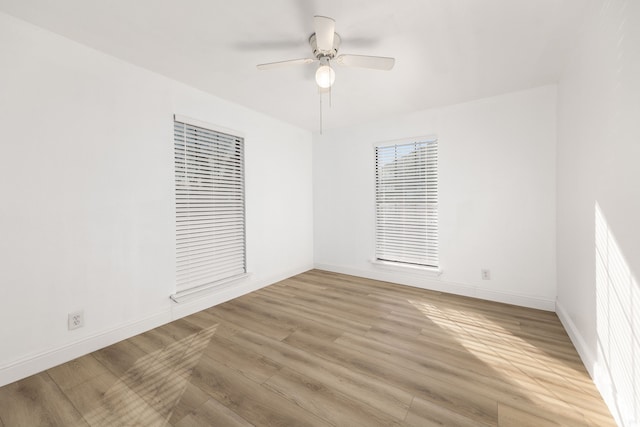 unfurnished room with ceiling fan and light hardwood / wood-style floors