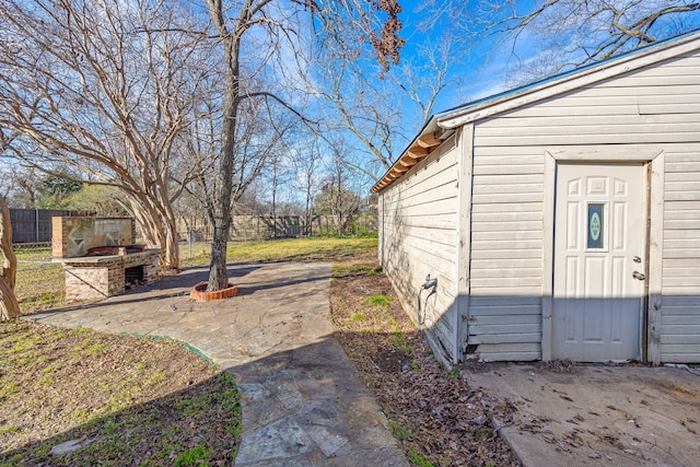 view of yard featuring a patio area and an outdoor structure