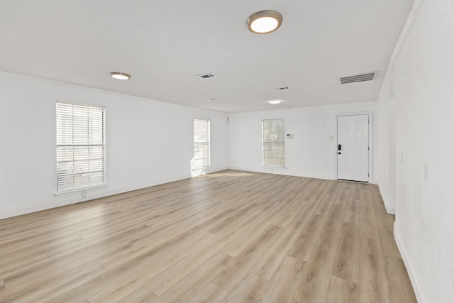 unfurnished room with light hardwood / wood-style flooring