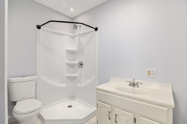 bathroom with walk in shower, vanity, and toilet