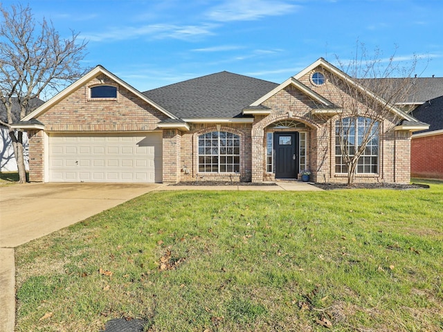 view of front of home with a garage and a front yard