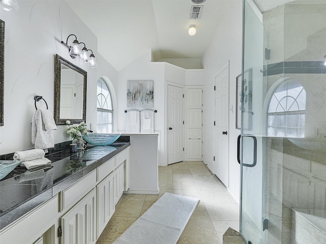 bathroom featuring a stall shower, visible vents, and vanity