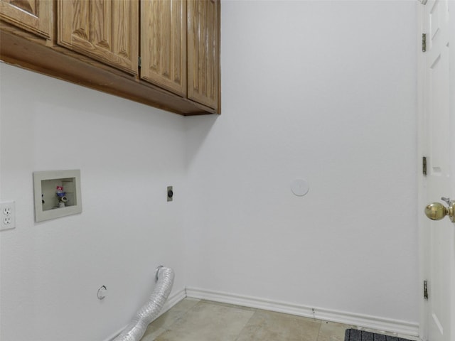 washroom with hookup for a gas dryer, washer hookup, baseboards, cabinet space, and electric dryer hookup