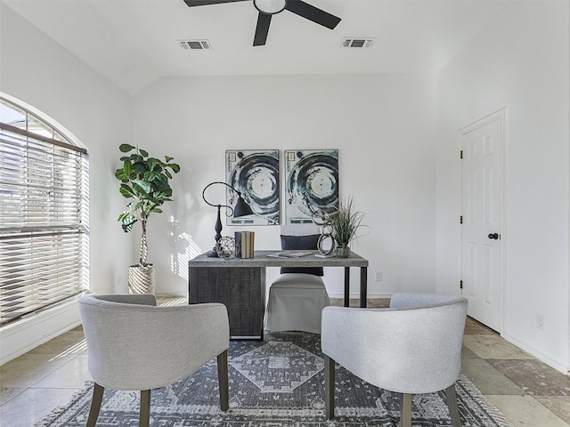 office area with ceiling fan, vaulted ceiling, visible vents, and baseboards