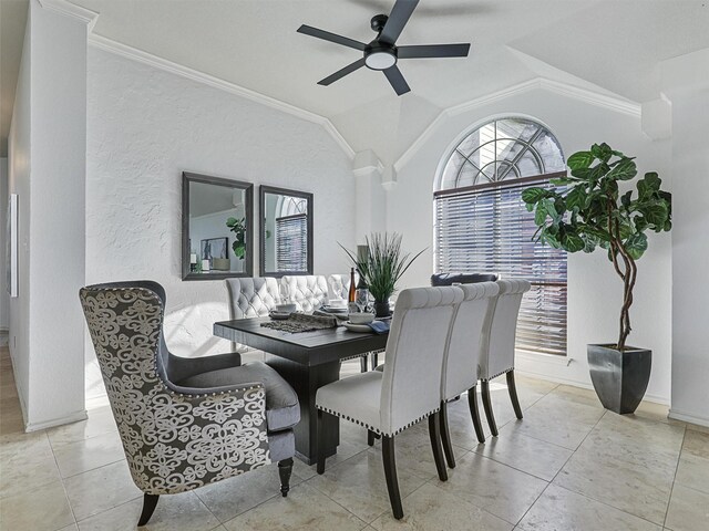 dining area featuring a ceiling fan, lofted ceiling, crown molding, and tile patterned floors