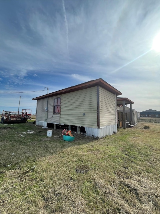 view of property exterior featuring a yard