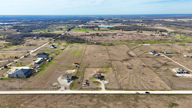 birds eye view of property featuring a rural view