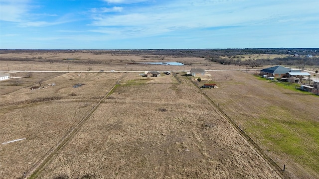 birds eye view of property featuring a rural view