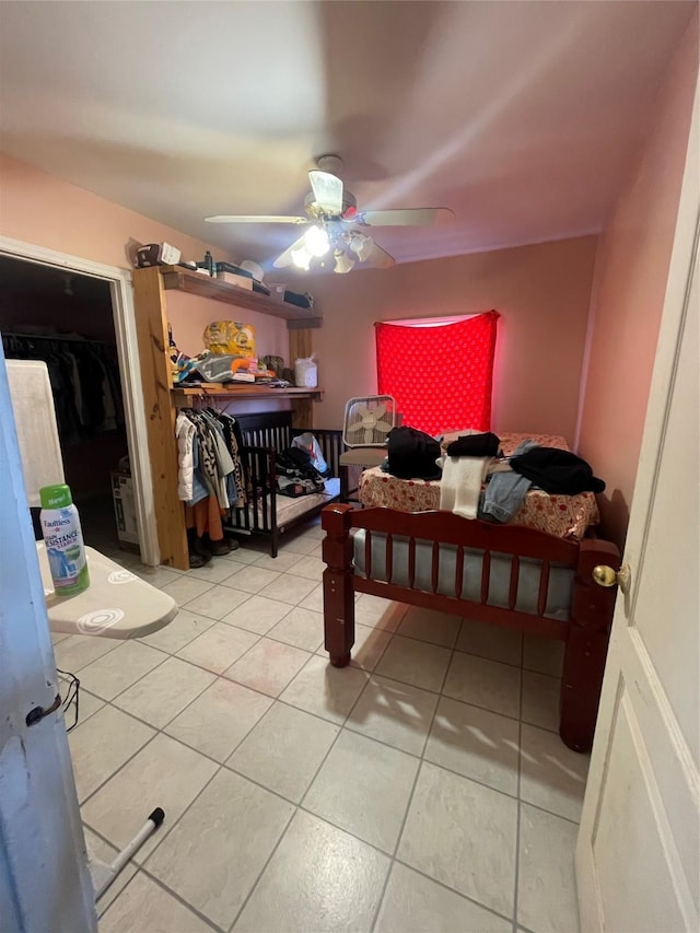 tiled bedroom with ceiling fan