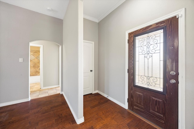 foyer featuring hardwood / wood-style flooring and ornamental molding