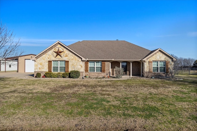 single story home with a garage and a front lawn