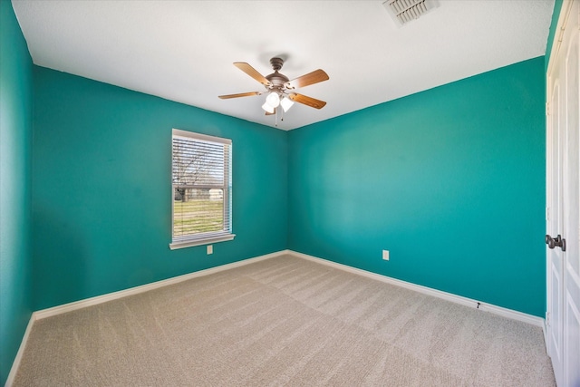 empty room with ceiling fan and carpet