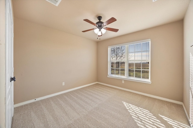 unfurnished room featuring light carpet and ceiling fan