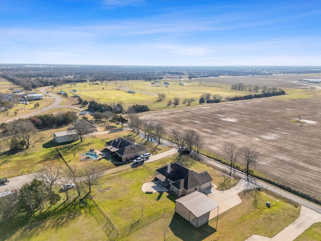 birds eye view of property with a rural view