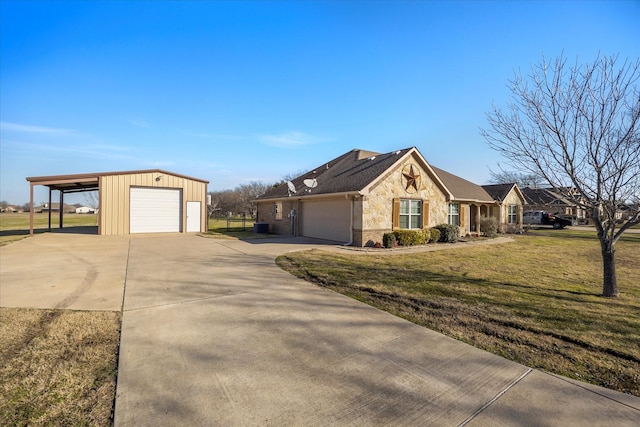 view of front of property with a front lawn, a garage, and a carport