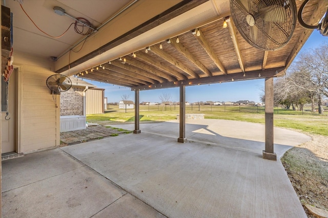 view of patio with a storage unit