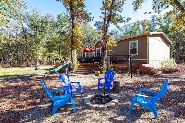 view of playground featuring a fire pit