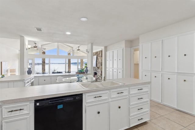 kitchen with sink, white cabinets, and black dishwasher